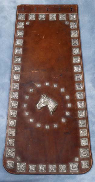 Edw H Bohlin Brown Silver Parade Serapes: Sterling silver mounted Edward Bohlin serapes with over sixty (60) square silver raised flower conchos in varying sizes (catalog patterns #458-463) The center of each serape is adorned with a striking