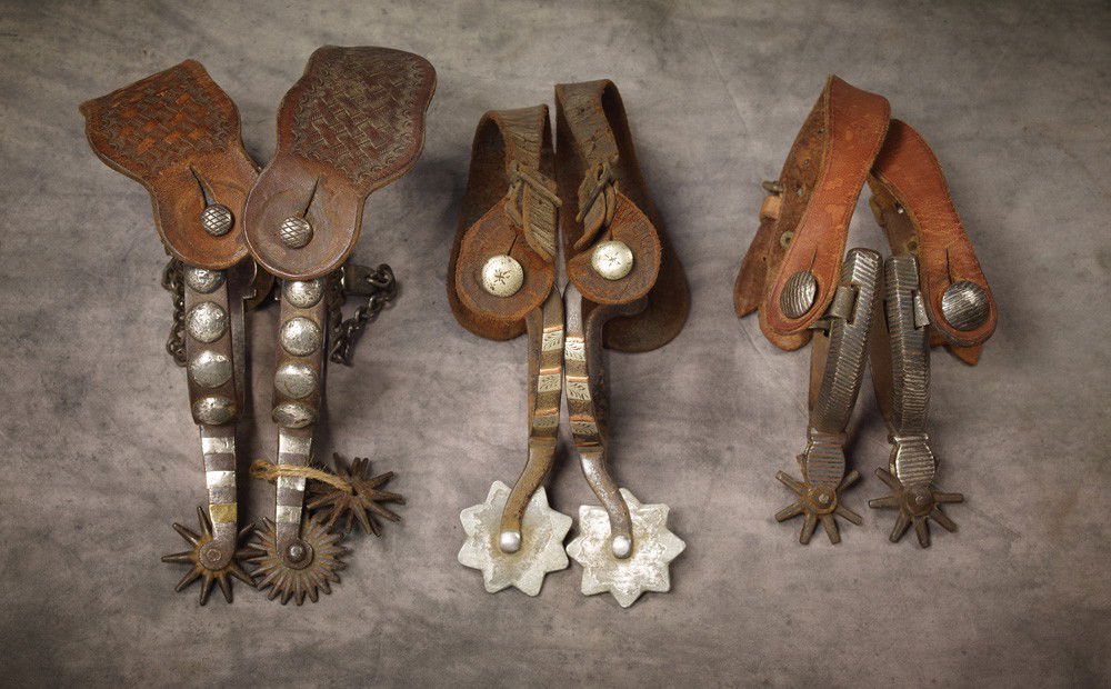 3 Pairs of Buck Jones family Spurs: a) August Buermann AB star marked / hand forged steel maker-marked straight shank spurs with four domed silver conchos on the heelbands, chased off-side, mismatched rowels and an extra matching set at