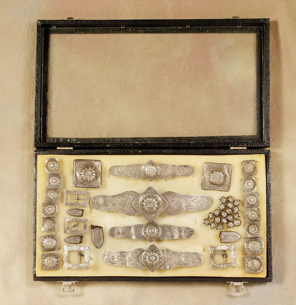 Edward Bohlin Silver Bridle Mountings: Forty four (44) heavy gauge Bohlinmade sterling silver pieces (circa 1940s) originally from probably an Escondido or Montecito model Parade Bridle. Included is the following: 14 - 1 1/8” square dais