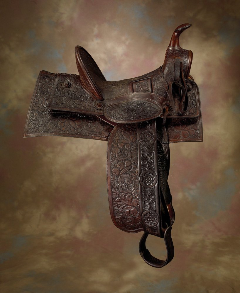 Early H Gregory, Redlands, Calif Saddle: Extremely rare and impressive late 19th / early 20th century, fully floral carved, square skirt, Southern California saddle with 14 1/2" seat, 5" high cantle. The carving is elegant and in remarkable 