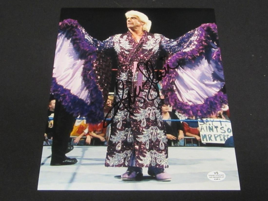 RIC FLAIR SIGNED 8X10 PHOTO WWF COA: AUTHENTIC RIC FLAIR AUTOGRAPHED 8X10 PHOTO THIS IS A WONDERFUL AUTOGRAPH. THIS ITEM HAS BEEN PROFESSIONALLY AUTHENTICATED & COMES WITH A COA. PLEASE DETERMINE CONDITION FROM PHOTO(S). SAVE US AS A SEL
