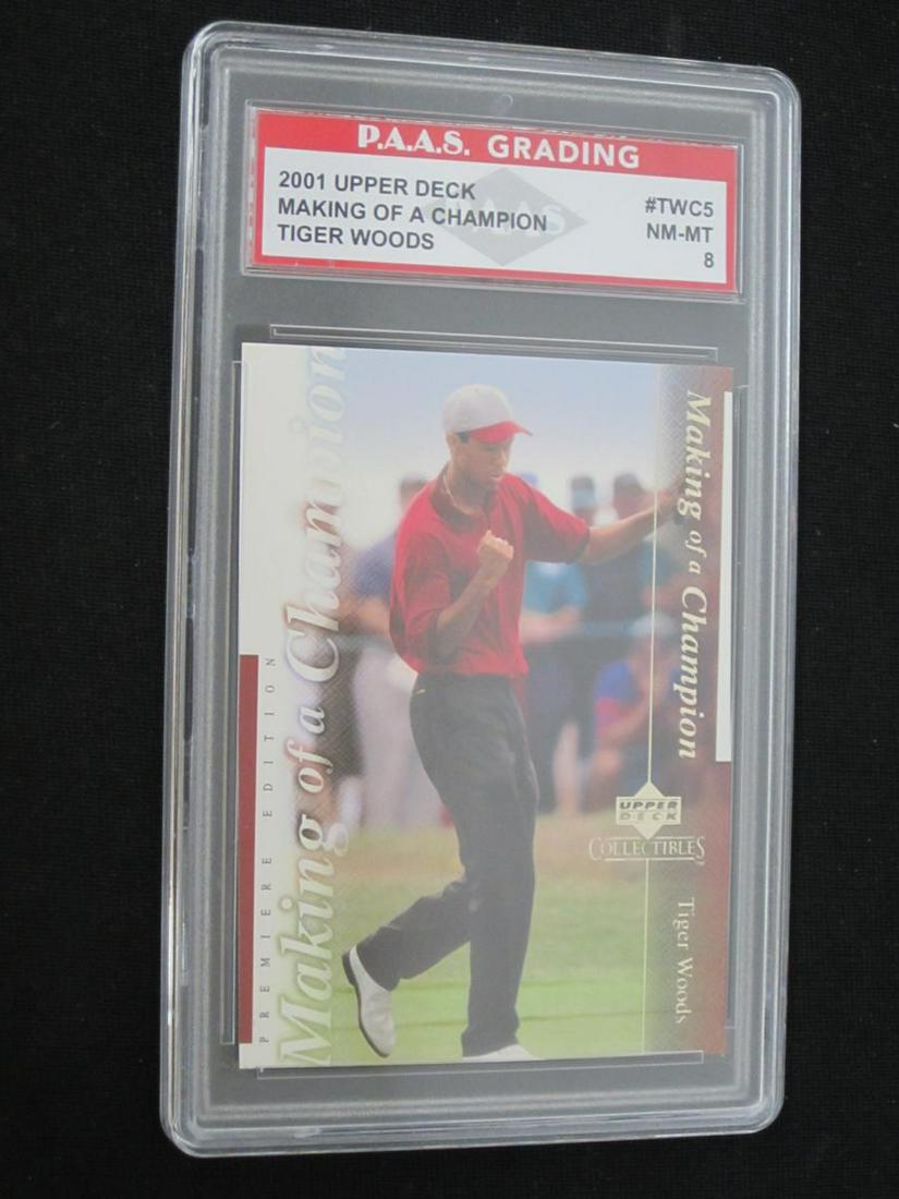 01 UD TIGER WOODS UDC RC PAAS NM 8: VERY NICE 2001 UPPER DECK COLLECTIBLES TIGER WOODS ROOKIE CARD MAKING OF A CHAMPION GRADED PAAS NM-MT 8 THIS CARD HAS BEEN PROFESSIONALLY GRADED & ENCASED. CHECK OUR OTHER AUCTIONS FOR A WIDE RANGE OF