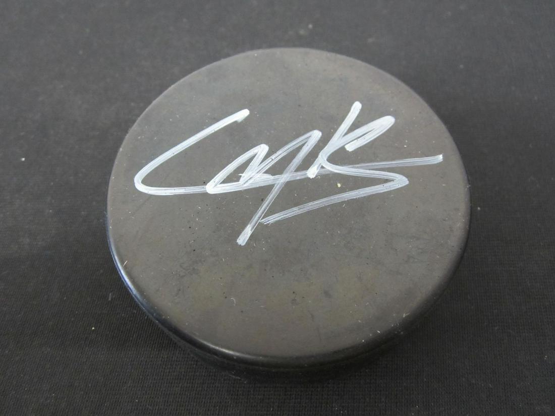 CALE MAKAR SIGNED HOCKEY PUCK W/COA: CALE MAKAR SIGNED HOCKEY PUCK WITH AUTO EXPERT UNION COA