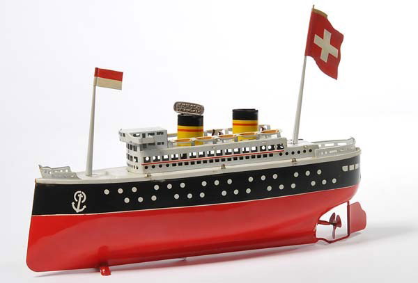 Arnold: English: Arnold, Ocean Liner, W.-Germany, tin, windup ok, flags replaced, 2 spots minimally repainted, otherwise good condition 2+ Deutsch: Arnold, Ozeandampfer, 32 cm, W.-Germany, Blech, Uhrwerk ok, 