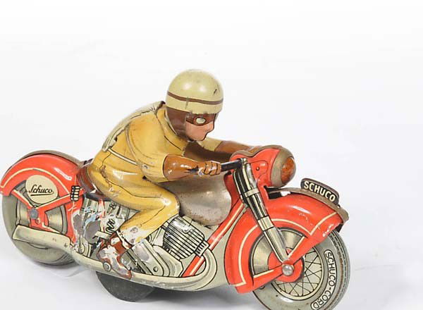 Schuco: English: Schuco, Motorcycle, US Zone Germany, tin, windup ok, severe paint damage on right side, bottom plate missing, condition 2-3 Deutsch: Schuco, Motorrad, US Zone Germany, 13 cm, Blech, Uhrwerk o