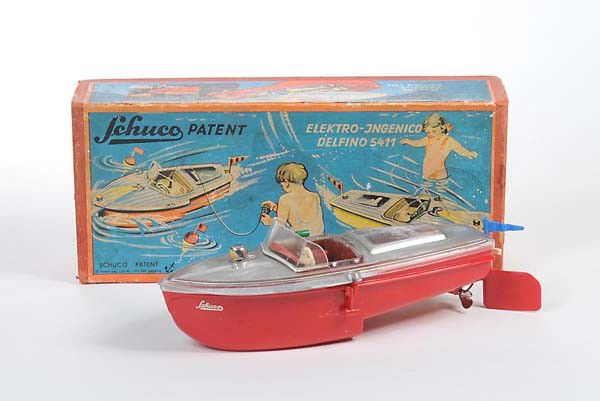 Schuco: English: Schuco, Electro Ingenico Delfino 5411, US Zone Germany, plastic, functions not checked, original box condition 2-, complete, condition 2+ Deutsch: Schuco, Electro Ingenico Delfino 5411, 24 cm