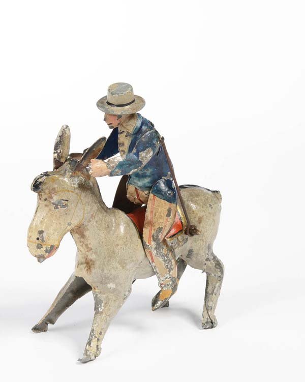 Guenthermann: English: Guenthermann, Man on Donkey (age-old), Germany prewar, tin, windup ok, severe paint damage, original condition Deutsch: Günthermann, Mann auf Esel (uralt), Höhe 16 cm, Germany VK, Blech, Uh