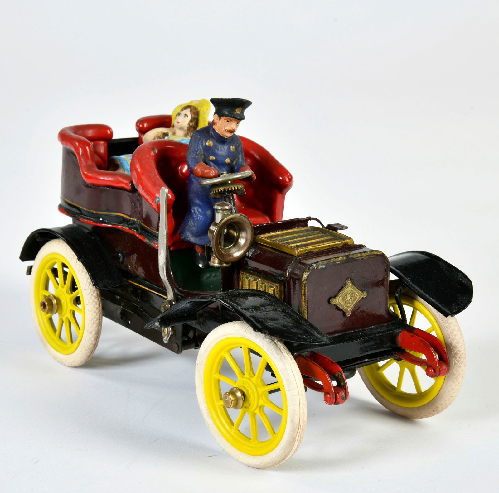 Bing, offener Viersitzer mit Heckeinstieg: Bing, open four-seater with rear entry, ca 1904, length 22 cm, mostly restored (?), parts replaced (?), clockwork ok, with bellows for driving noise, 2 replica figures, 1 lantern missing