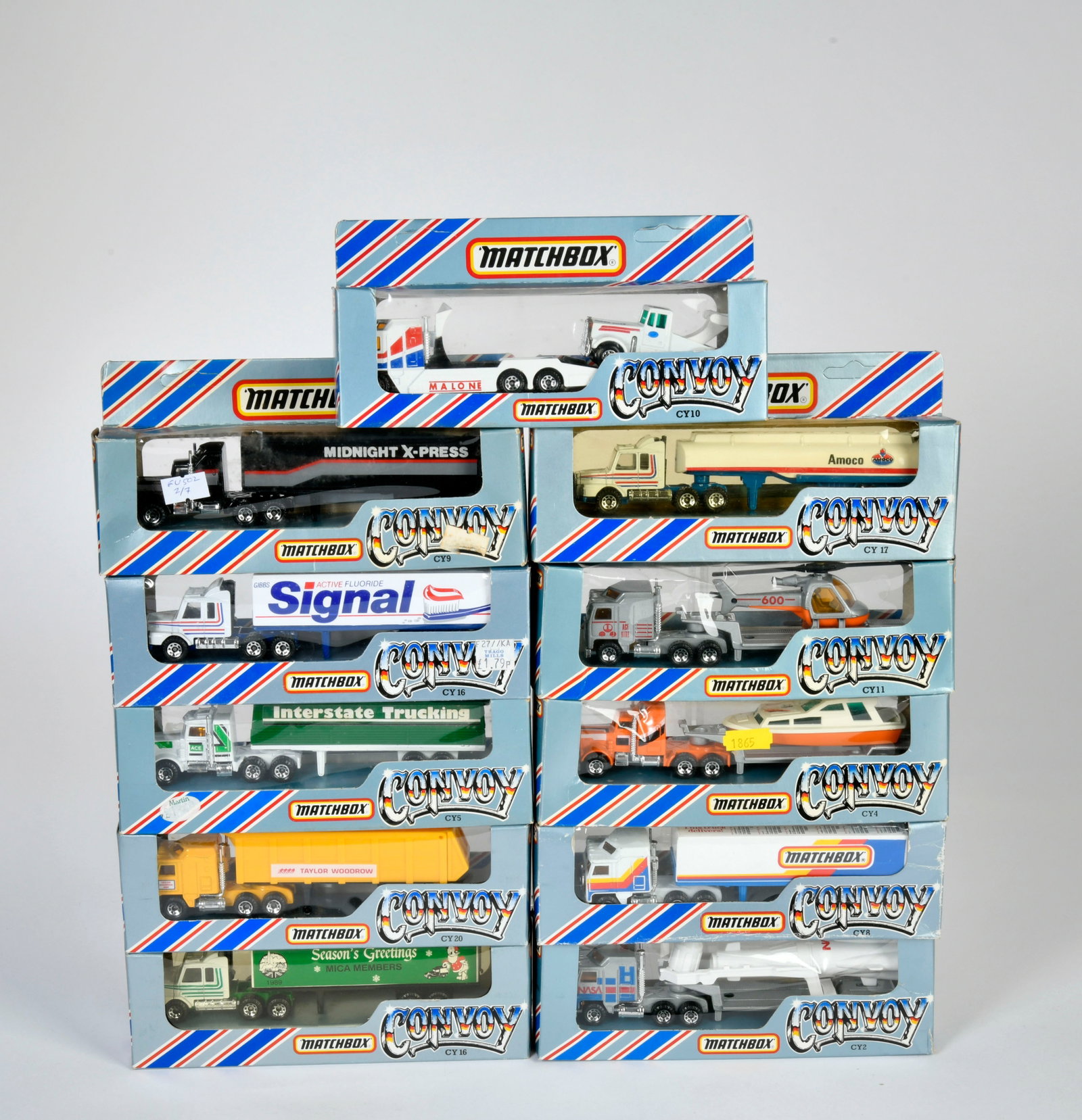Matchbox Convoy (graue Verpackung), CY20, CY17, 2x CY16, CY8, CY16, CY2, CY4, CY5, CY8, CY10, CY11: Matchbox Convoy (graue Verpackung), CY20 Kenworth Coe Tipper ("Taylor Woodrow"), CY17 Scania Petrol Tanker ("AMOCO"), 2x CY16 Scania Box Truck, ("SIGNAL" + "Seasons Greetings ..."), CY8 Kenworth Box T