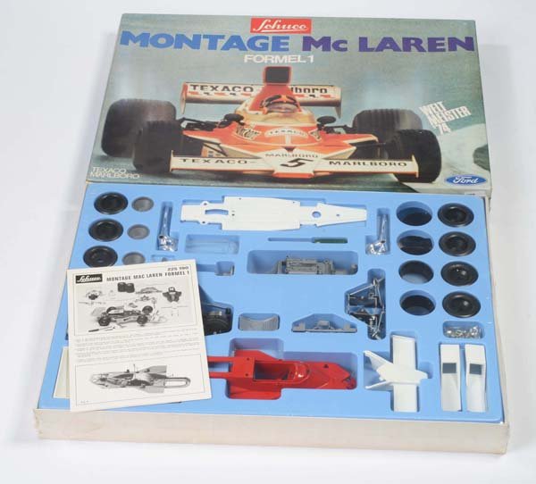 Schuco: English: Schuco, "Mc Laren" kit, W.-Germany, mixed material, original box condition 1-, packed in foil, condition 1, Deutsch: Schuco, Montage "Mc Laren", W.-Germany, 37 x 50 cm, Gemischtbauweise, Okt 