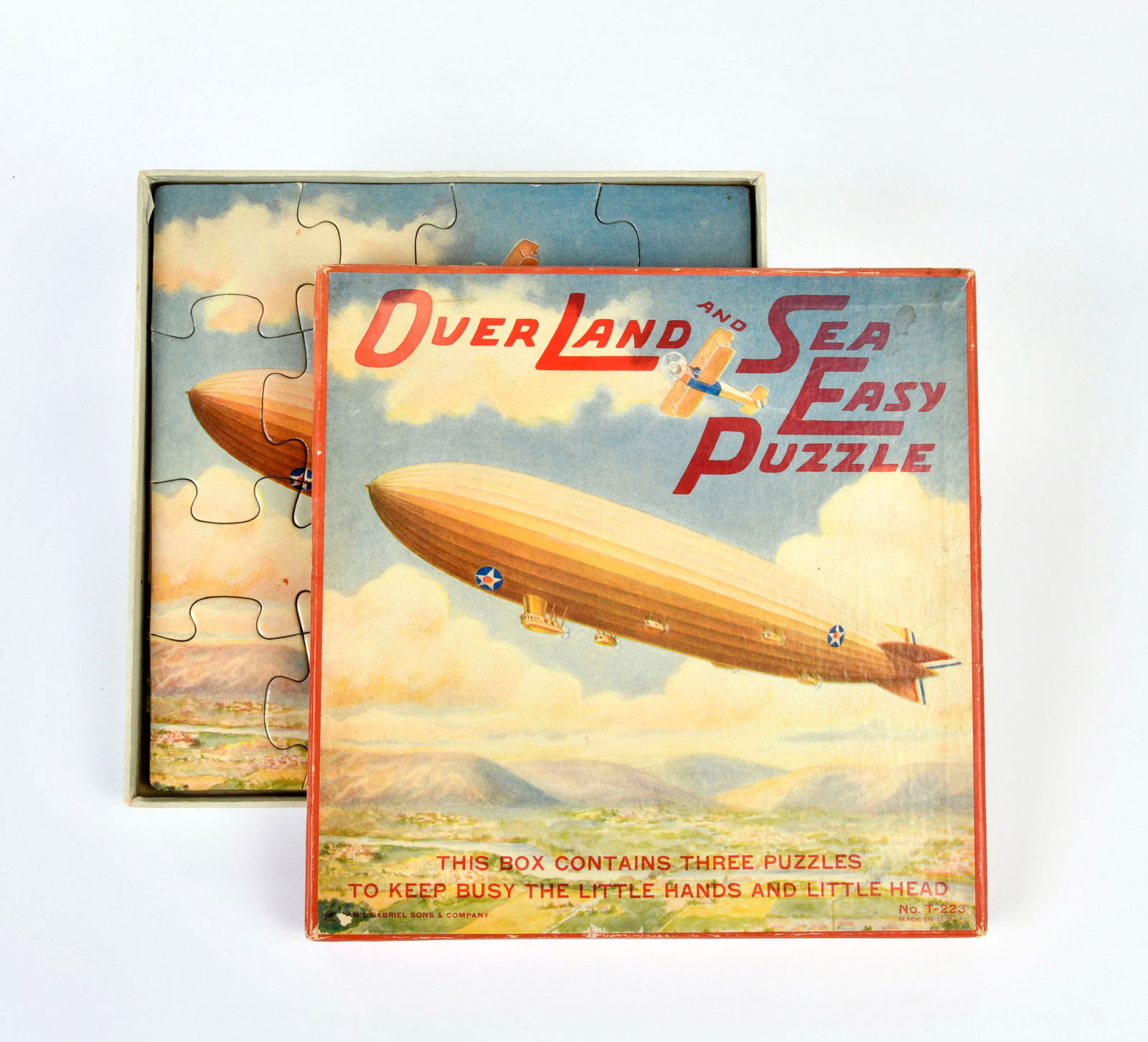 Sam'l Gabriel Sons & Company, Zeppelin-Puzzle "Over Land and Sea Easy Puzzle": Sam'l Gabriel Sons & Company, Zeppelin puzzle "Over Land and Sea Easy Puzzle", USA, 3 x 16 parts traffic motifs: steam ship, locomotive, zeppelin, complete, C 2