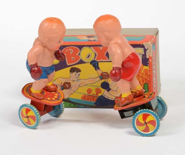 Yone: English: Yone, Boxer, Japan, mixed materials, celluloide, windup ok, original box condition 1-2 Deutsch: Yone, Boxer, Japan, 16 cm, Gemischtbauweise, Celluloid, Uhrwerk ok, Okt Z 1-2, (3348)