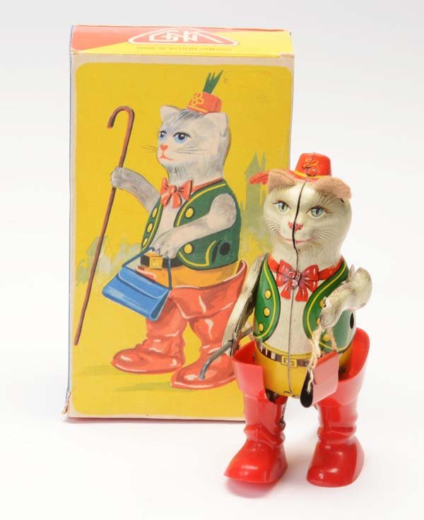 Koehler: English: Koehler, Puss in Boots, W.-Germany, tin, boots out of plastic, windup ok, paint damage on left arm because of function, original box condition 1.2, very good condition 1-2 Deutsch: Köhler, G