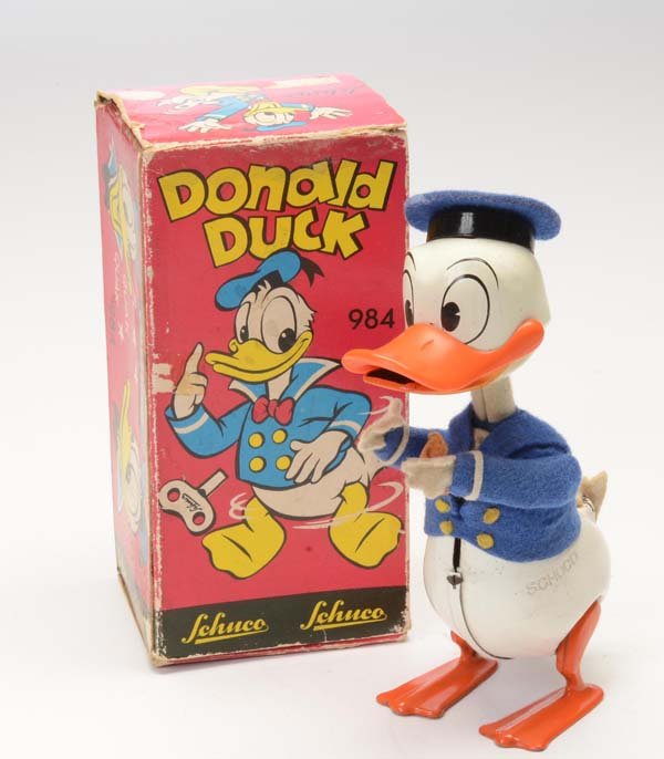 Schuco: English: Schuco, Donald Duck, W.-Germany, tin, windup ok, original box condition 2-, feet out of tin, without tin, condition 1- Deutsch: Schuco, Donald Duck, 15 cm, W.-Germany, Blech, Uhrwerk ok, Okt