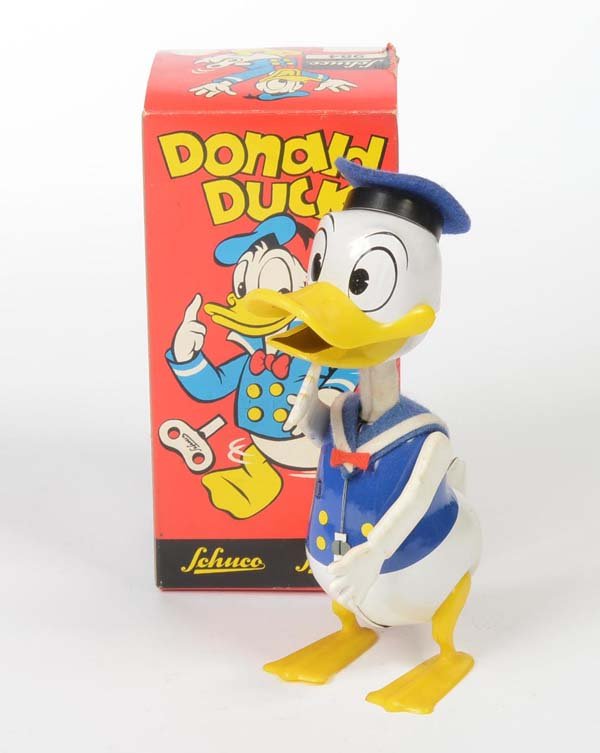 Schuco: English: Schuco, Donald Duck, W.-Germany, tin, mixed materials, windup ok, minimal paint damage, original box condition 1-2, condition 1-2 Deutsch: Schuco, Donald Duck, W.-Germany, 15,5 cm, Blech, Gem