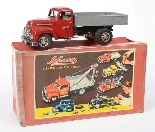 Schuco: English: Schuco, construction truck, W.-Germany, functions not checked, paint damage, original box partly glued, original box condition 2-3, with remote control+battery compartment, condition 2-3 Deut