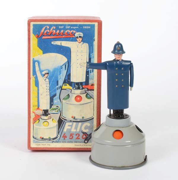 Schuco: English: Schuco, Bobby-policeman, US Z. Germany, tin, wind up ok, original box condition 1, condition 1 Deutsch: Schuco, Bobby-Polizist, US Z. Germany, 13 cm, Blech, Uhrwerk ok, Okt Z 1, Z 1, (471)