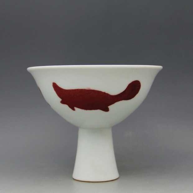 A red under glazed porcelain high foot bowl: A Ming dynasty red underglazed porcelain high foot bowl H 5 in.