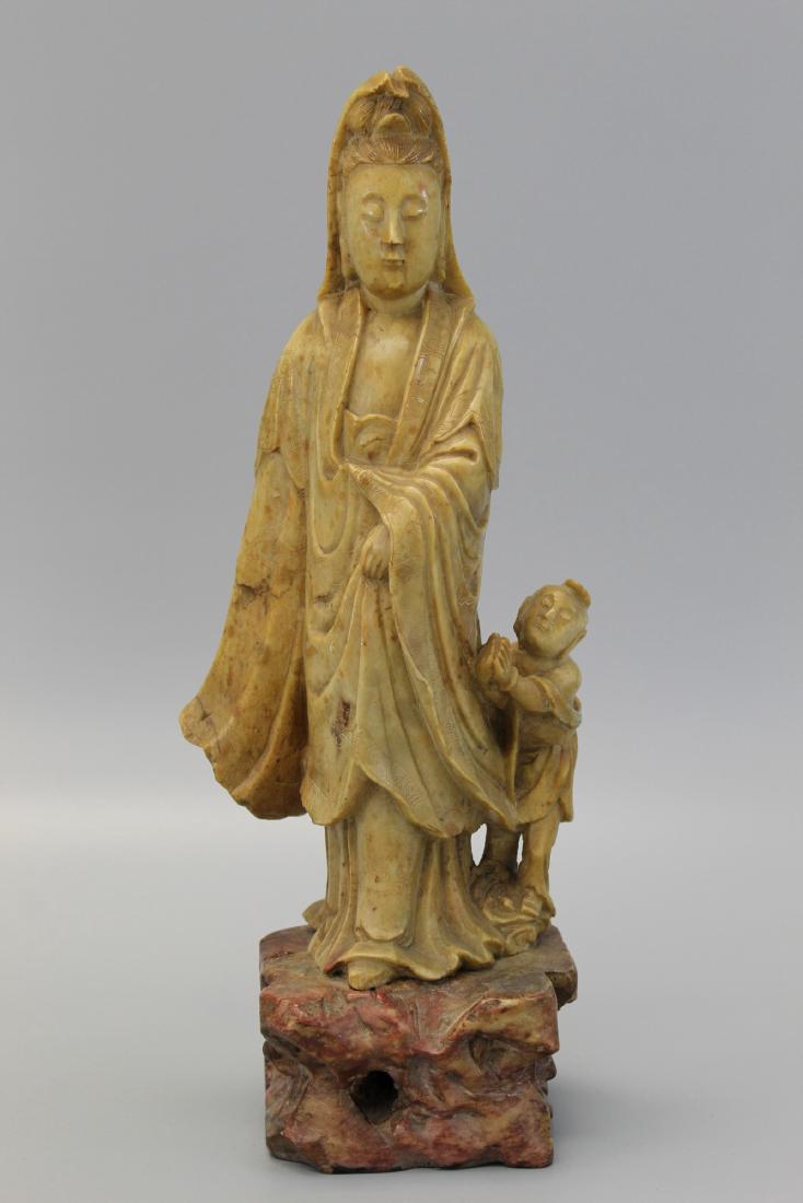 Chinese carved soapstone Guanyin.: Chinese carved soapstone Guanyin. Ht 34 cm.