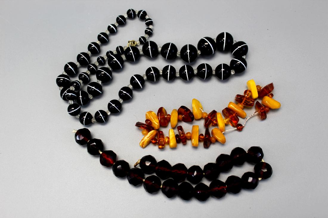 Three glass  and amber beads necklaces. (1 of 2)