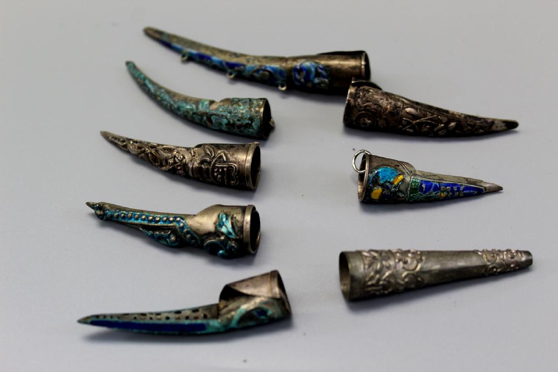 Eight Chinese silver nail protectors. (1 of 3)
