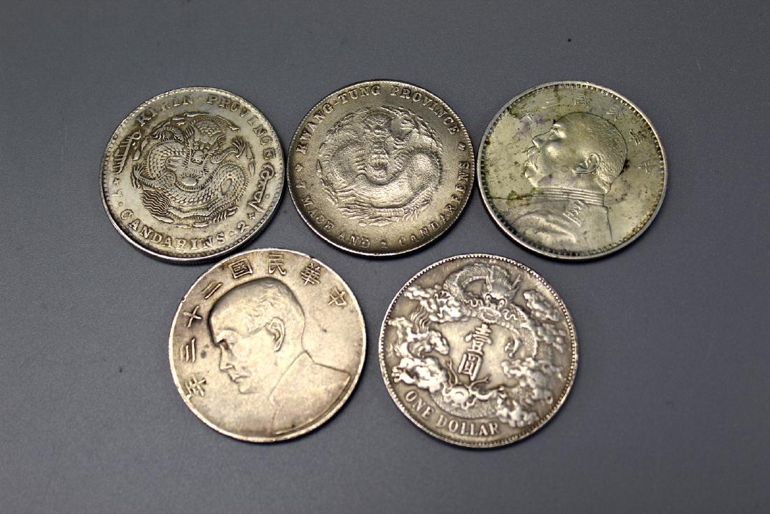 Five Chinese silver coins. (1 of 2)