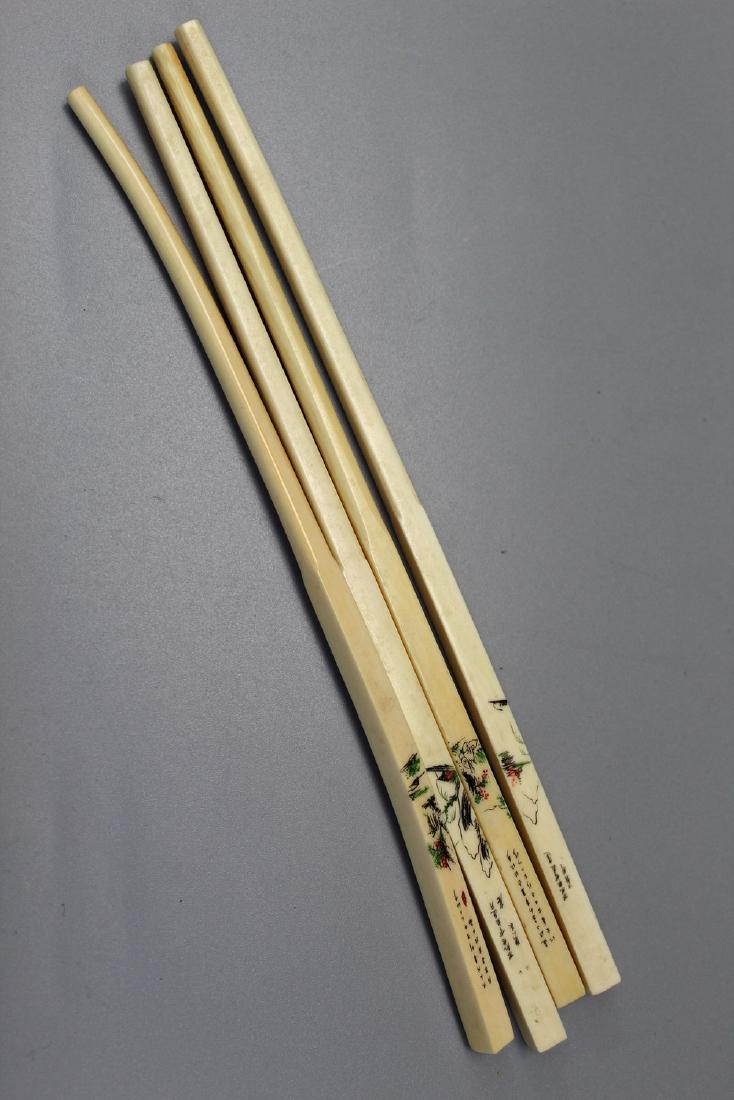 Four Chinese miniature carved chop sticks. (1 of 2)
