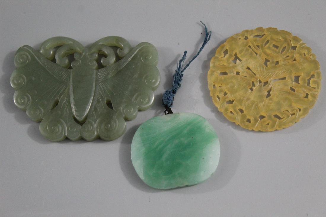 Three Chinese carved jade pendants. (1 of 2)
