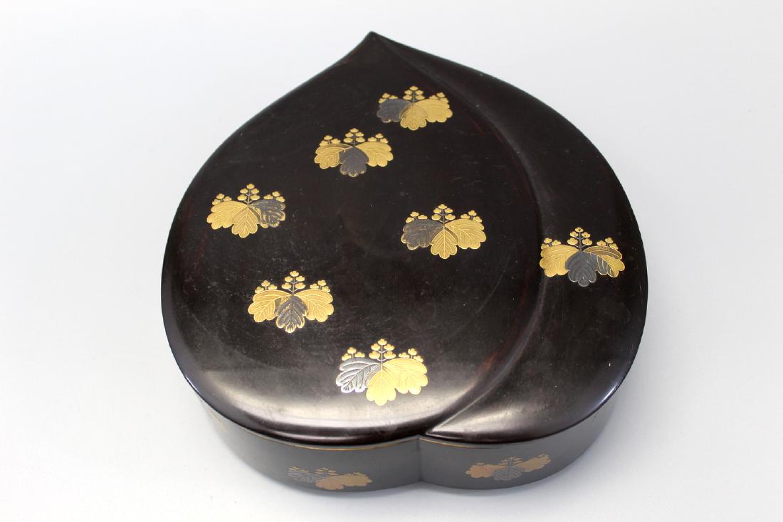 A Japanese peach shaped lacquer box. (1 of 4)