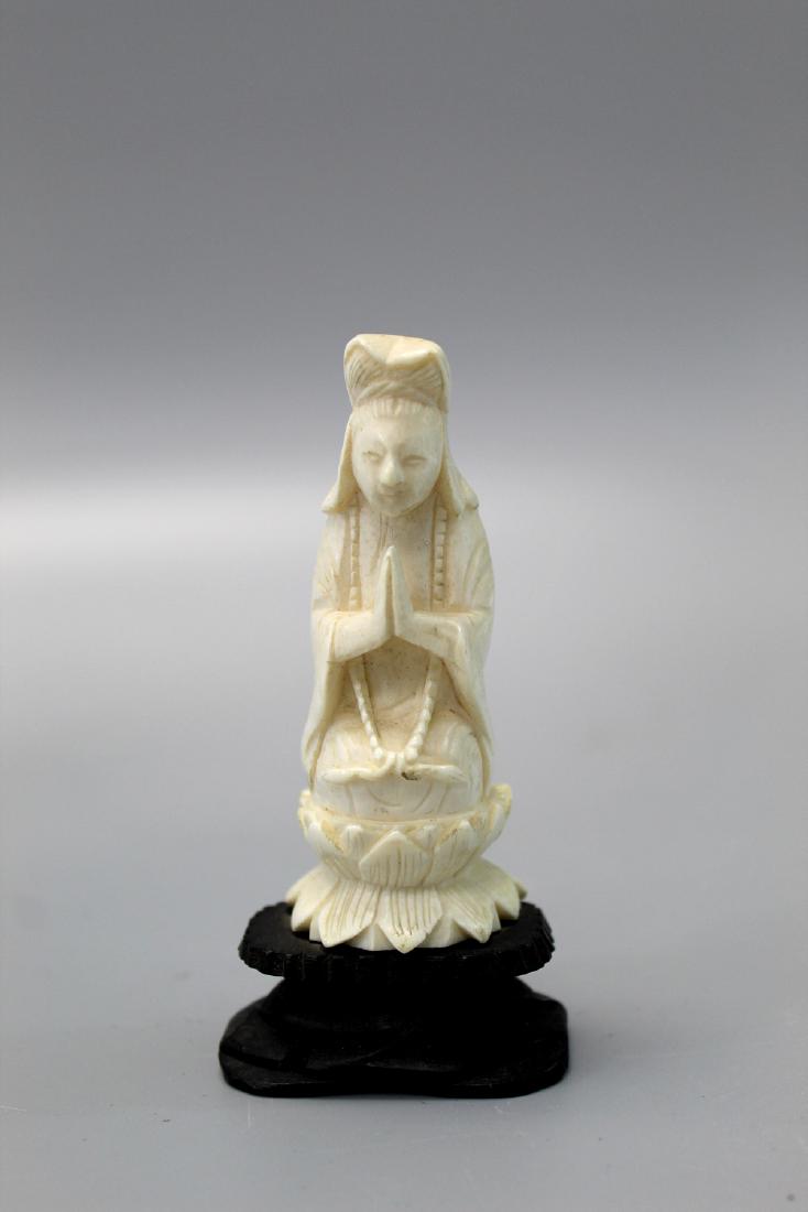 Chinese carved statue of Buddha on wood stand. (1 of 2)