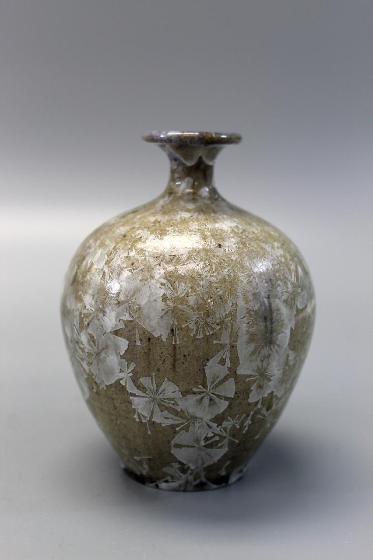 Pottery vase with mark on the bottom.: Pottery vase with mark on the bottom. Ht 11 cm.