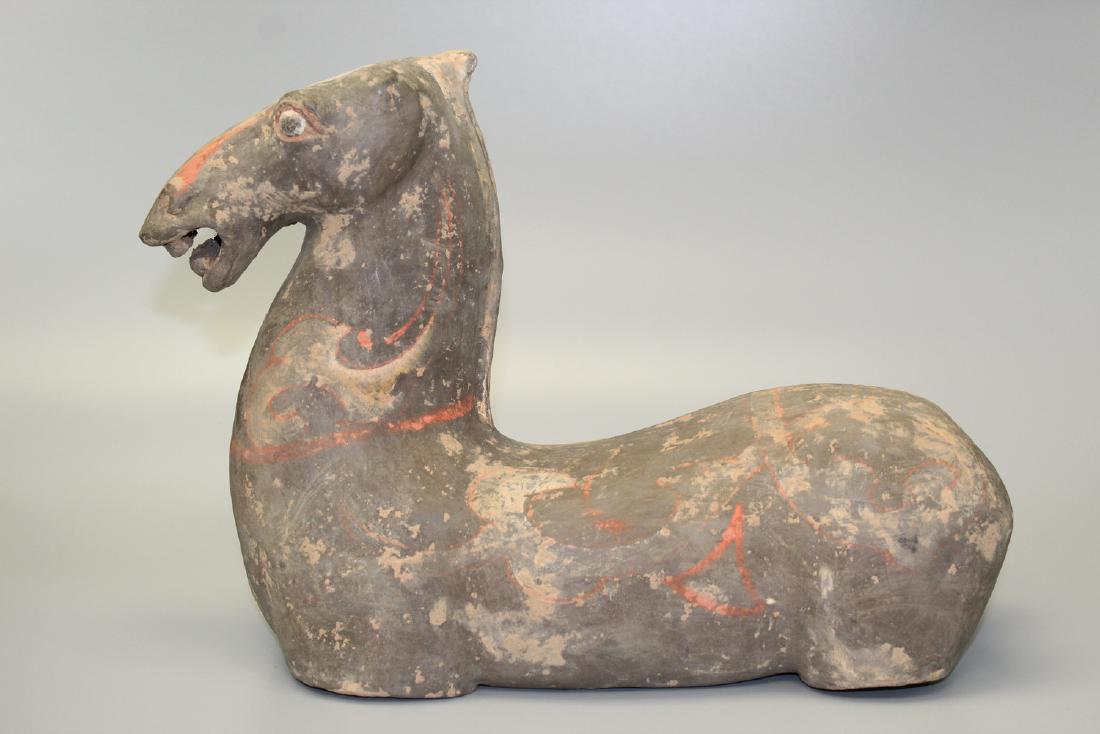 Chinese Han dynasty pottery horse.: Chinese Han dynasty pottery horse. L 36 cm. Ht 25 cm.