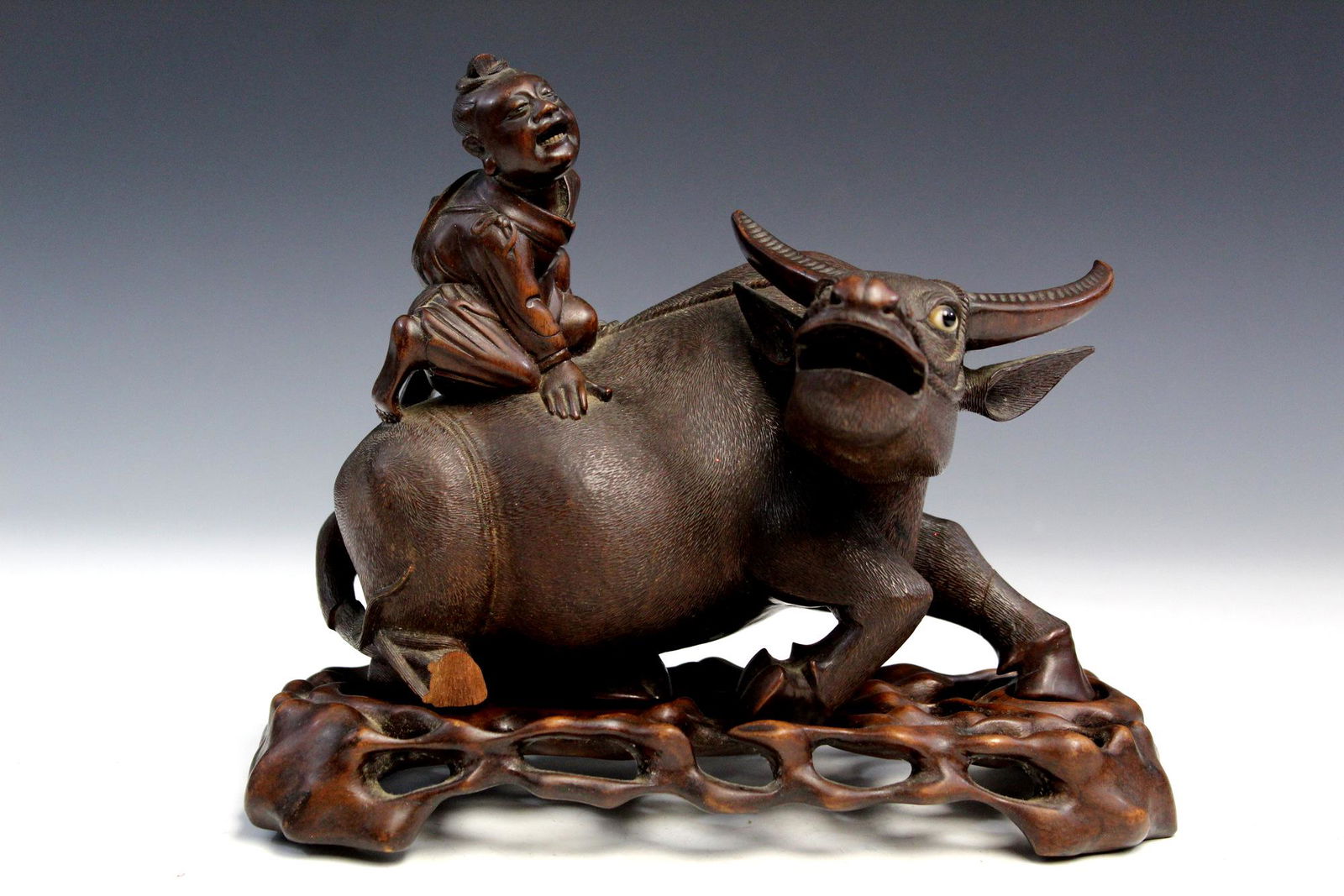 Chinese carved wood statue of a boy riding on an ox.: Chinese carved wood statue of a boy riding on an ox. Ht 17 cm. Provenance: From Maria Worthington estate in Virginia. Maria Worthington lived in Philippines with her husband, Amos, who worked for the