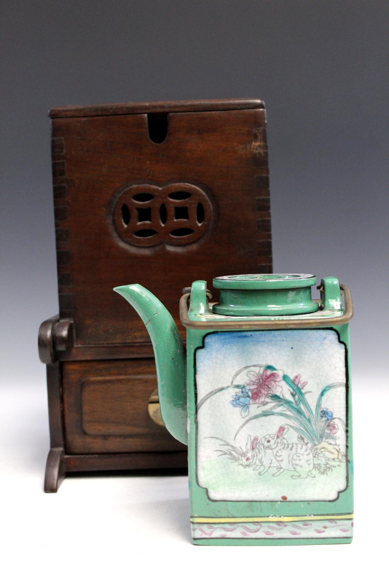 Chinese enamel on pottery teapot in rosewood box.: Chinese enamel on pottery teapot in rosewood box. Box height 23 cm. Length 15 cm. Teapot height 13 cm.