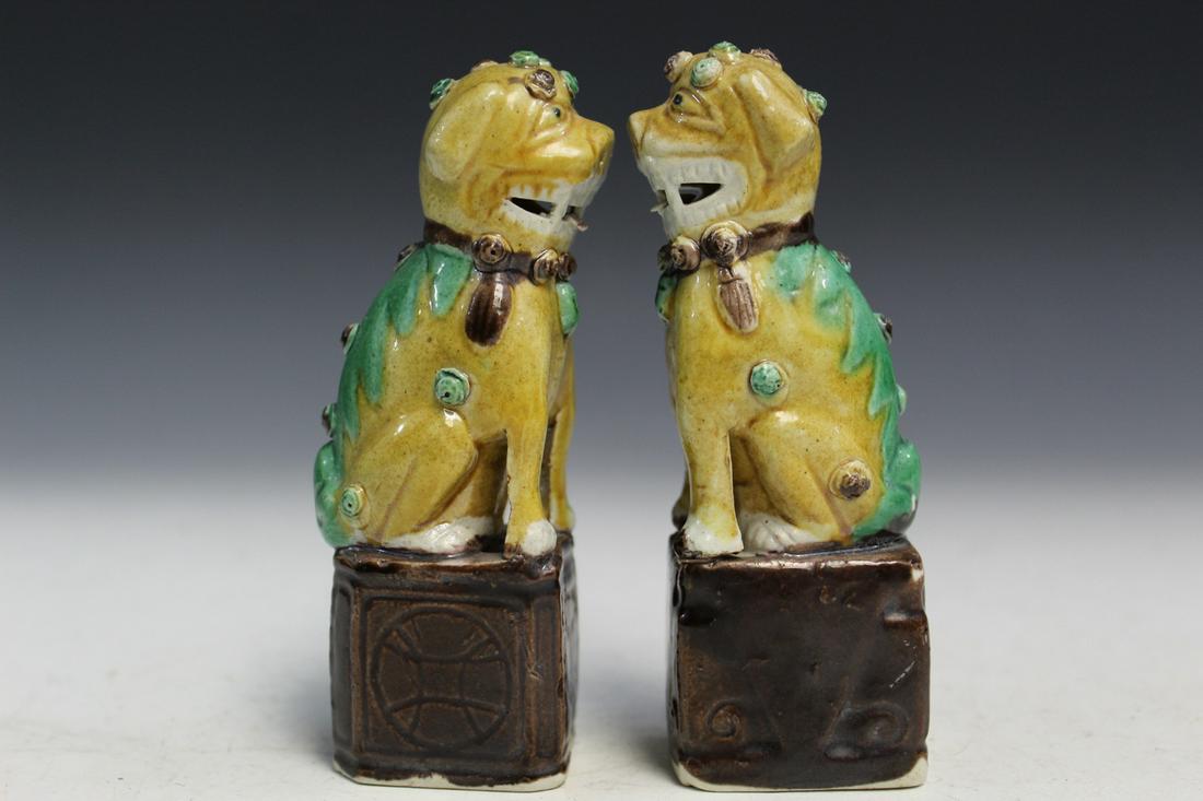 Pair of Chinese Porcelain Foo Dogs: Pair of Chinese Porcelain Foo Dogs. H 11 cm