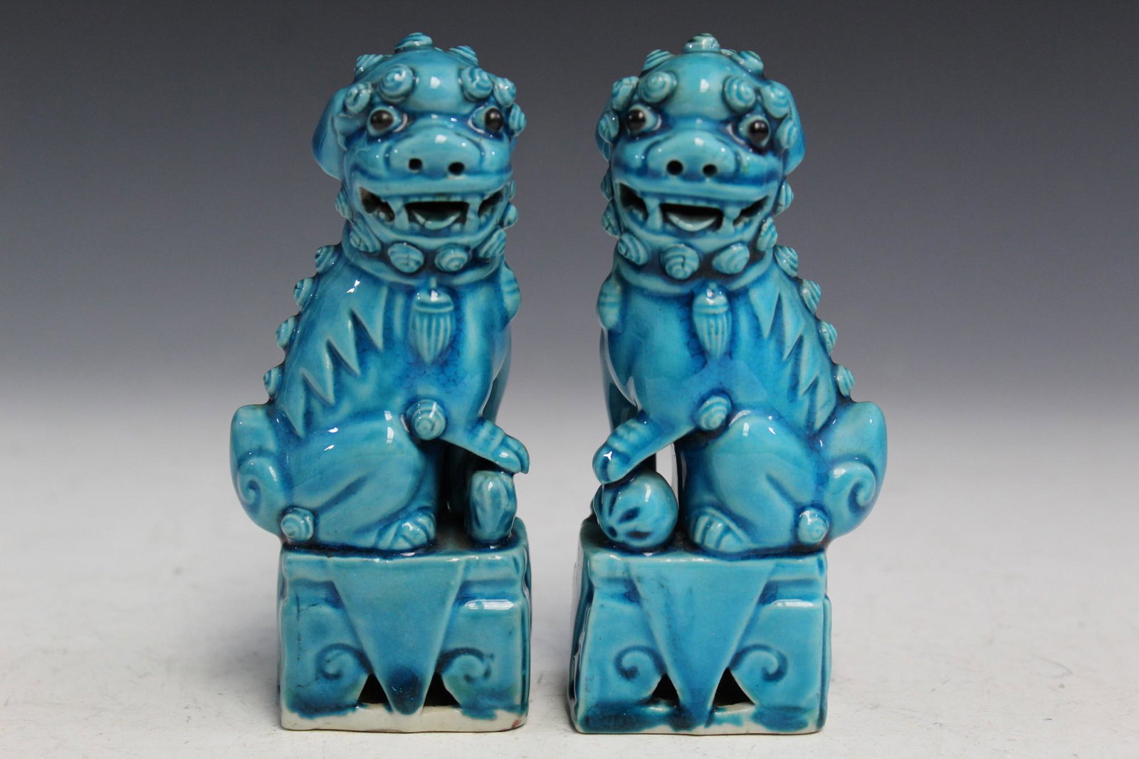 Pair of Chinese Turquoise Glaze Porcelain Foo Dogs: Pair of Chinese Turquoise Glaze Porcelain Foo Dogs. H 11 cm