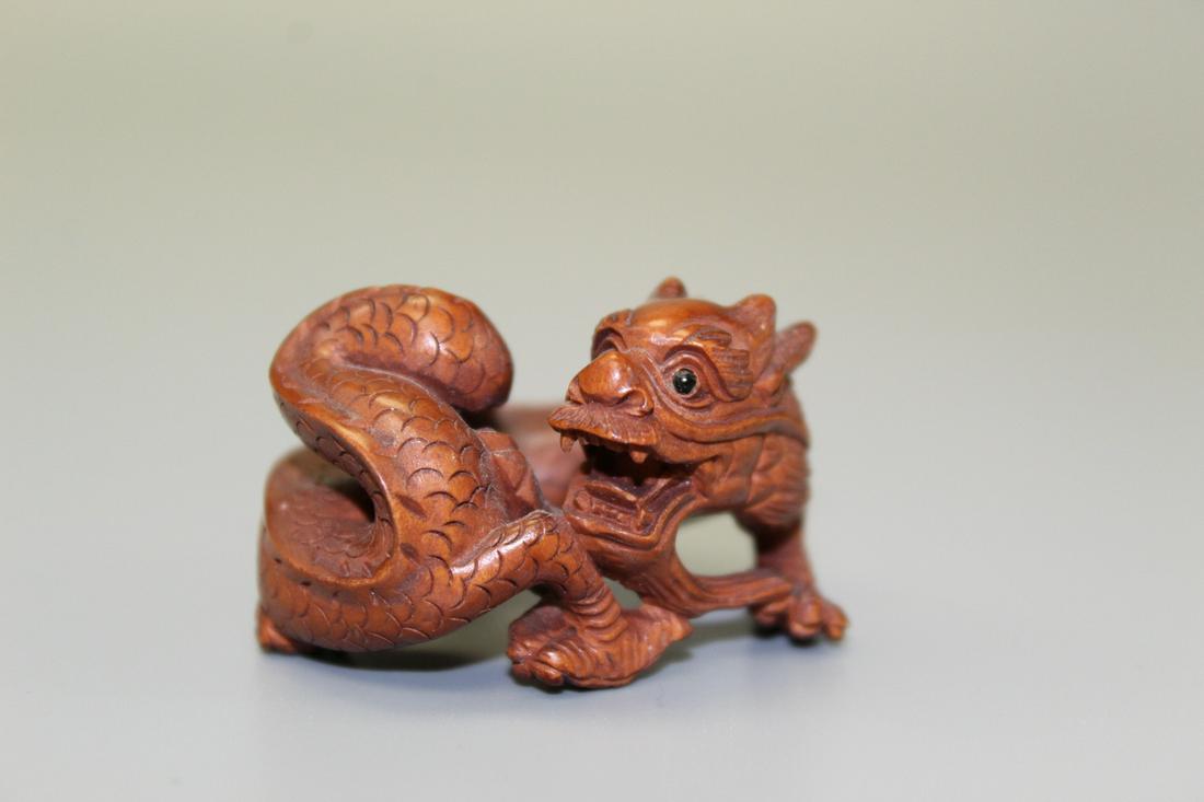 Dragon, Japanese wood carving, maker: Dragon, Japanese wood carving, maker's mark on the bottom. Width 5 cm. Height 3 cm.