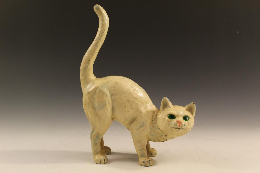 Cast iron cat door stopper.: Cast iron cat door stopper. H 28 cm.