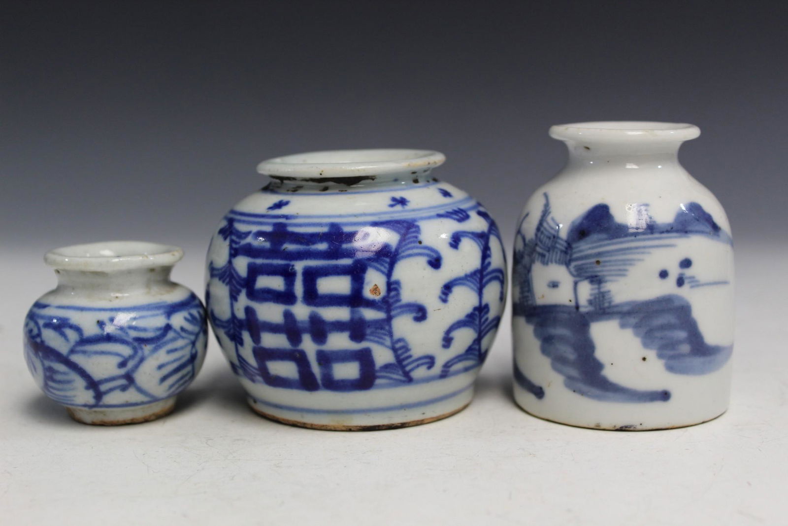 Three Chinese blue and white porcelain miniature jars. (1 of 3)