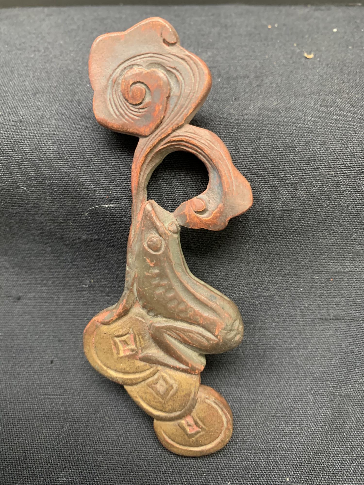 Wood carving of coins and a frog: Wood carving of coins and a frog. about 4" L