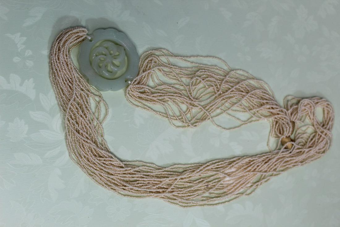 Multi-strand necklace with Carved Jade Pendant. (1 of 4)