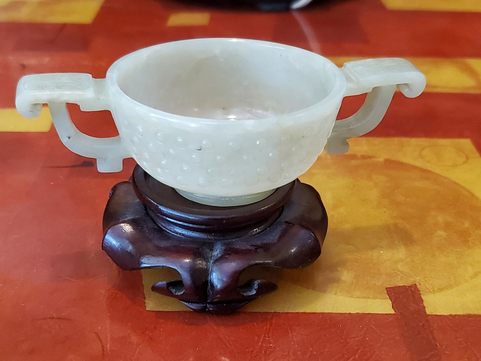 Chinese carved jade cup on wood stand. (1 of 6)