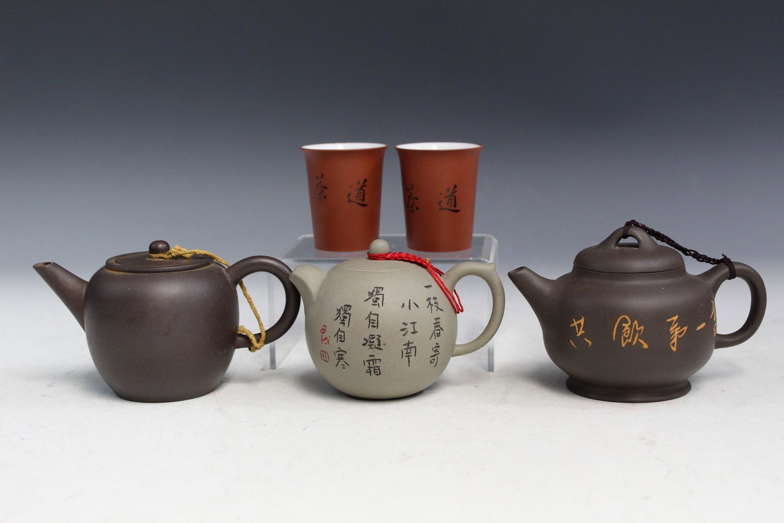 Chinese Yixing Teapots and Cups: Chinese Yixing Teapots and Cups. Largest Teapot L 12 cm.