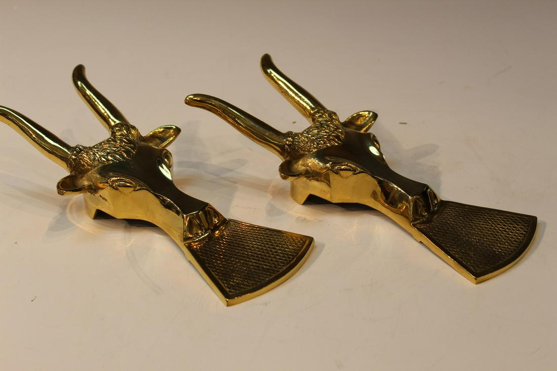 Pair of brass boot removers shaped as Bull: Pair of brass boot removers shaped as Bull. L 25cm