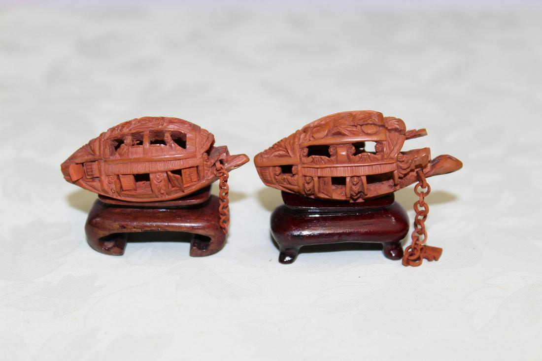 Two Chinese Carved Nuts: Two Chinese Carved Nuts. L 4 cm