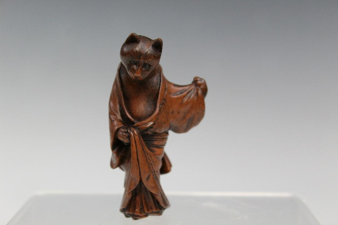 Resin Reproduction Netsuke of a Cat: Resin Reproduction Netsuke of a Cat. Marked PMS. H 6 cm