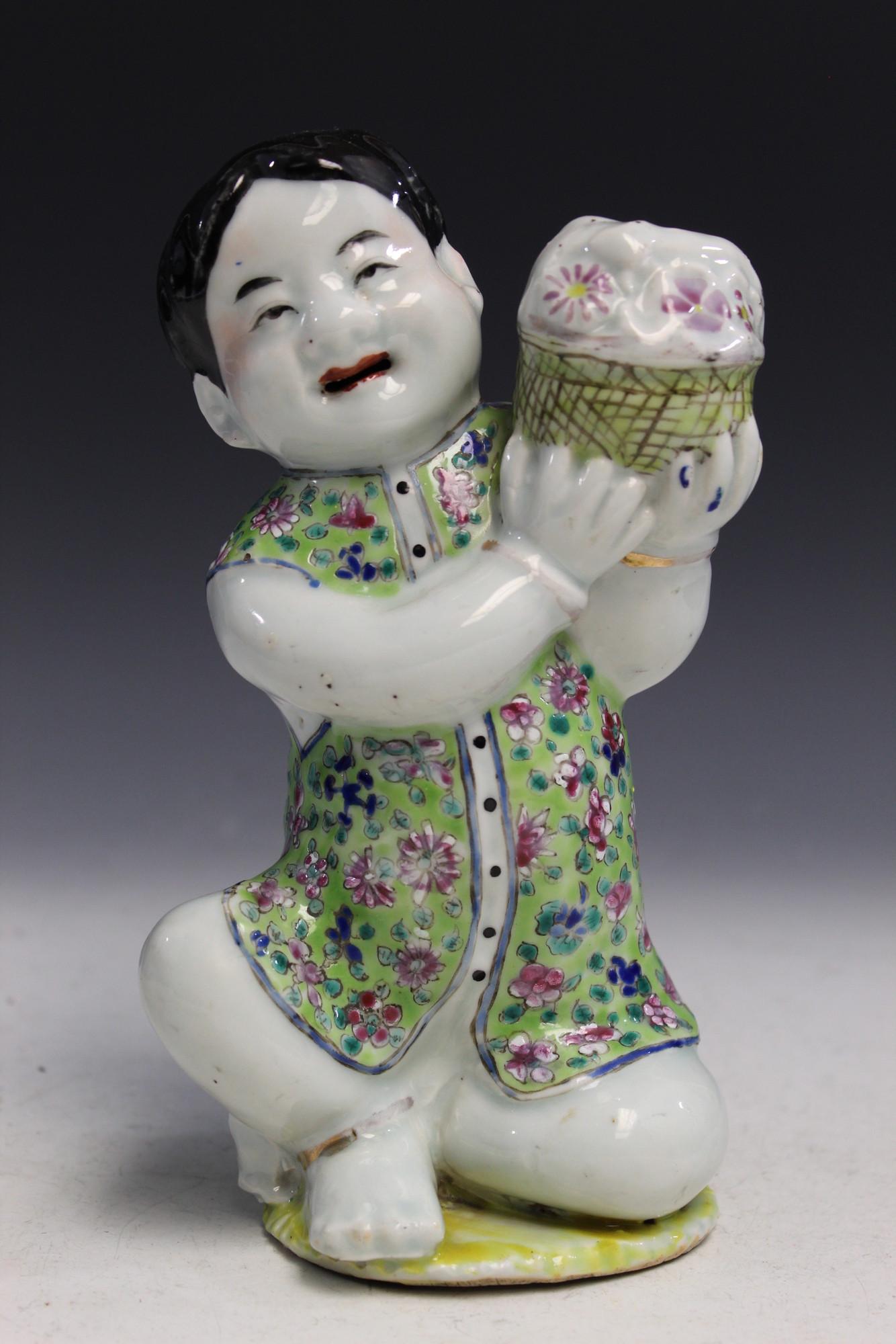 Chinese famille rose porcelain statue of a boy holding (1 of 4)