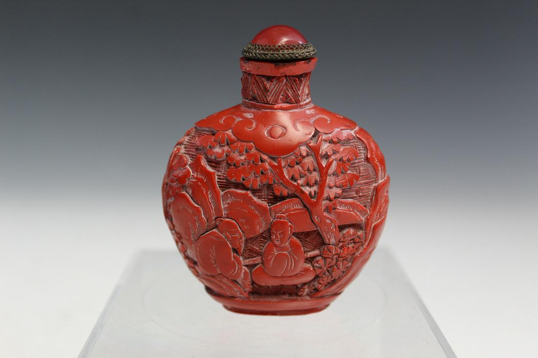 Chinese Carved Cinnabar Snuff Bottle.: Chinese Carved Cinnabar Snuff Bottle. H with lid 7.5 cm