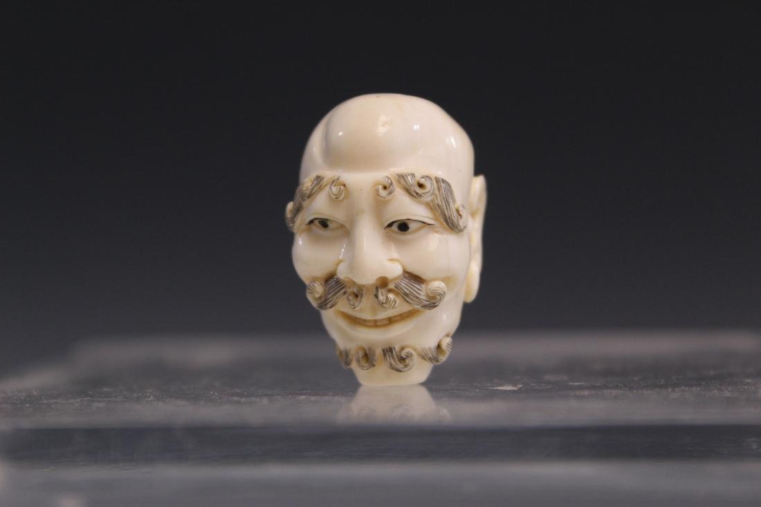 Japanese carved bead of a monk head (1 of 3)