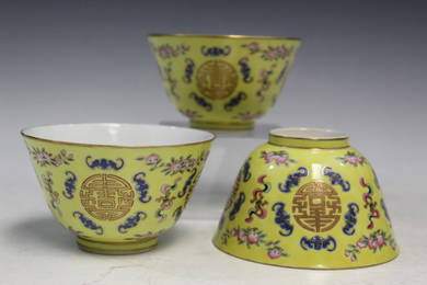 Three Chinese Yellow Ground "Peach and Shou" Cups.